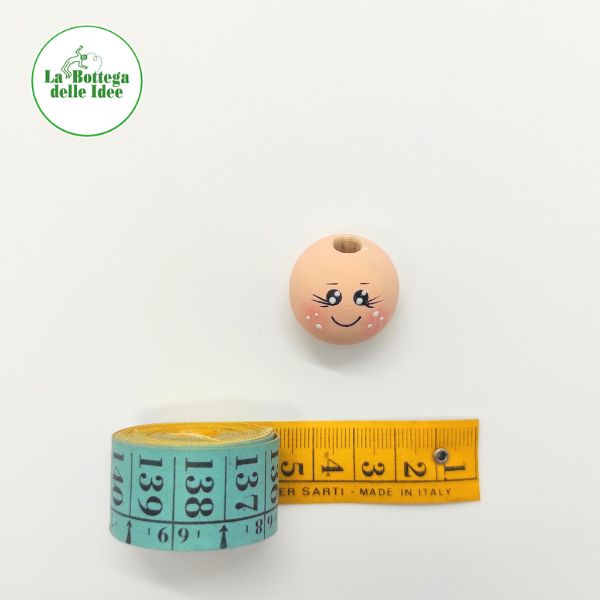 testina decorata su base in legno dipinto color pelle