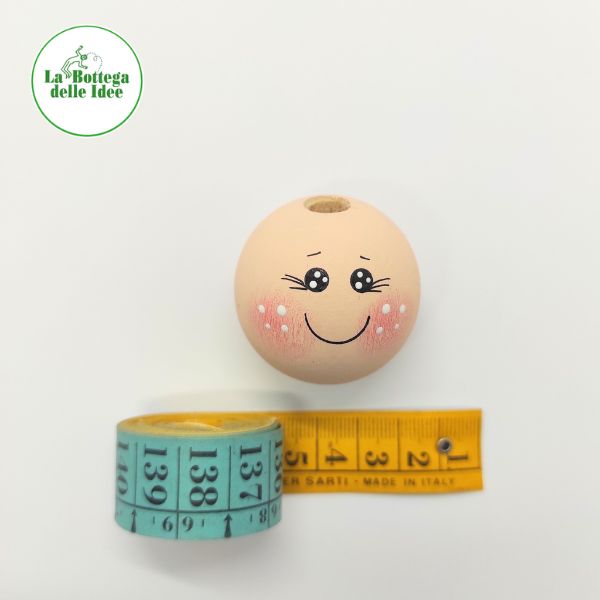 Testina decorata su base in legno dipinto color pelle