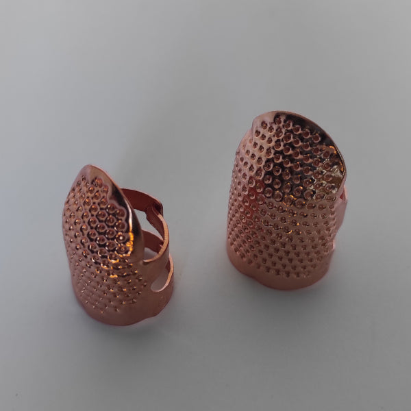 Set 2 protezioni per polpastrelli - metallo rosa - regolabile